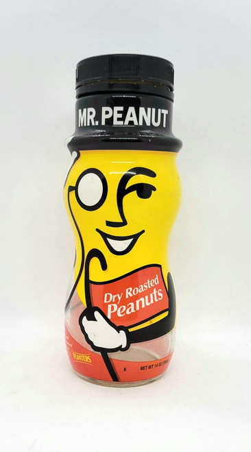 Planters Mr. Peanut Wrapped Glass Peanuts Jar, yellow jar with Mr. Peanut character cartoon design holding a label that says Dry Roasted Peanuts.