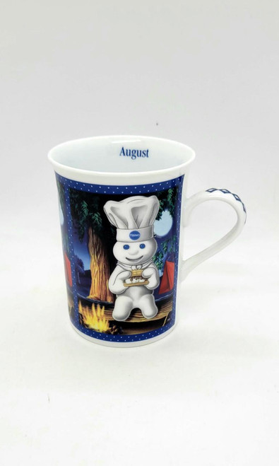 Pillsbury Doughboy Fine Porcelain Collector Mug, August Summer Vacation Treat with Doughboy chef holding food, camping scene at night with tent, campfire, and trees.