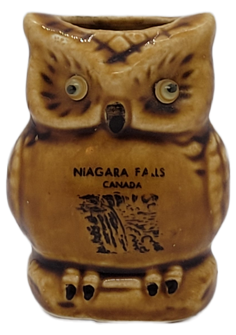 Front view of ceramic owl toothpick holder with Niagara Falls Canada lettering and waterfall illustration.