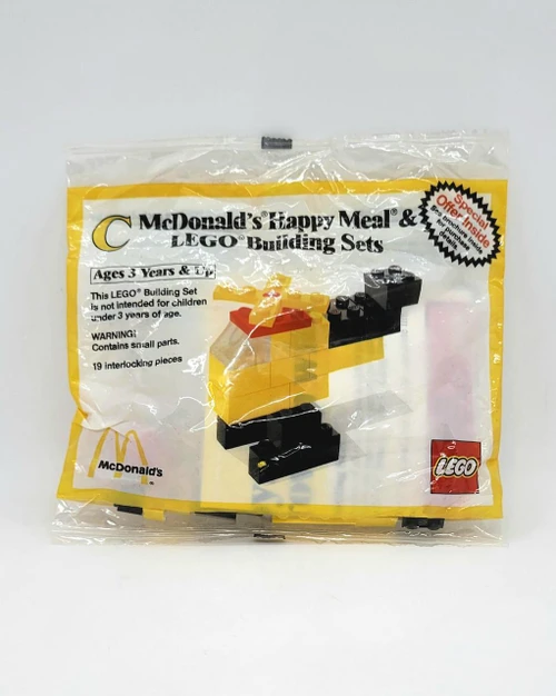 Product Lego McDonald's Happy Meal LEGO Building Sets C- 1986 Helicopter, unopened plastic bag with yellow, black, and red LEGO pieces and packaging design.
