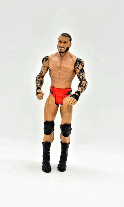 WWE 2011 Randy Orton Action Figure (Loose), detailed action figure of wrestler Randy Orton with tattoos, red trunks, black knee pads and boots, posed stance.