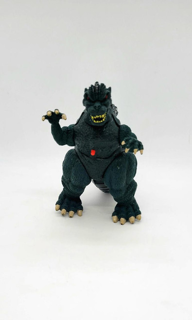 Trendmasters Supercharged Godzilla Action Figure (Loose), detailed black plastic figure of Godzilla with red eyes, yellow teeth, and poseable arms and claws.