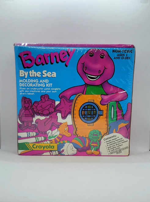Barney Crayola Barney By The Sea Molding And Decorating Kit, colorful box with Barney the dinosaur illustration and sea-themed moldings and decorating accessories inside.