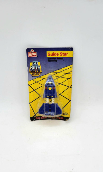 GoBots Guide Star Guardian Robot Spaceship Wendy's Kids Meal Toy, vintage blue toy spaceship in packaging with yellow grid design and logo.