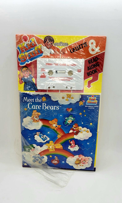 Care Bears Meet The Care Bears Cassette & Read Along Book, vintage childhood toy set featuring a cassette tape and a colorful illustrated storybook with Care Bears on rainbow clouds.
