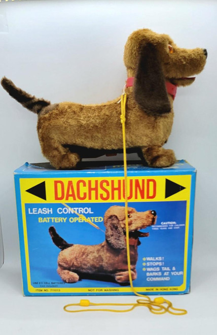 Unbranded Battery Operated Leash Control Dachshund, plush Dachshund toy with leash and box packaging.