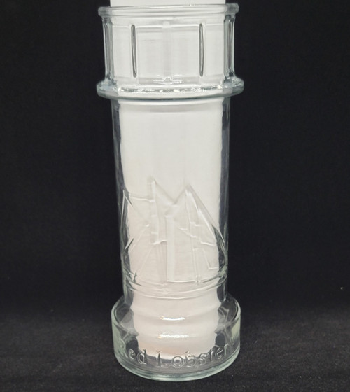Promotional drinking glass from the Reb Lobster restaurant chain.  The glass is in the shape of a lighthouse with sail boats on it.