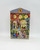 Hershey's Village Series Canister #2 School House, decorative tin container with detailed illustration of a schoolhouse with children and adults in front, showcasing vibrant colors and classic design.