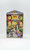 Hershey's Village Series Canister #2 School House, colorful decorative tin canister featuring a detailed illustration of a schoolhouse with children and a teacher outside, with blooming flowers and window scenes.