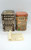 D.E. Wolfgang Candy Bavarian Village Canister #02-95 Market Square Tin, decorated with intricate scenes of Bavarian architecture and market life, vintage collectible storage tin.