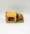 Kennel Kuddlees Tara Toy 1986 Kennel Kuddlees Dog Stuffed Animal, plush dog toy inside colorful box with floral and house design.