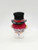 M&M's Minis Candy Dispenser - Christmas Top Hat, small toy shaped like a person wearing a red coat, white pants, and a black top hat with a transparent cap on top.