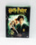 Harry Potter And The Chamber Of Secrets DVD Set, image of the DVD case featuring Harry Potter, Ron Weasley, Hermione Granger, and the creature Dobby the house elf in front of the Hogwarts castle backdrop.