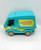 Scooby-Doo The Mystery Machine Playset, colorful toy van in blue and green with yellow flowers and the text 'The Mystery Machine' on the side.