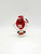 M&M Candy Topper Ornament, Red M&M Skiing, with a Santa hat and holding ski poles.