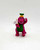 Barney & Friends PVC Cheerleader Barney Toy Figure, colorful pink dinosaur mascot in cheerleading outfit with a green top, yellow hat with a letter B, holding a small white flag with 'GO' written on it, and waving one arm.