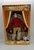 Living Toyz NSYNC Collectible Marionette JC Chasez, doll dressed in red shirt and khaki pants displayed in vintage circus-style packaging.