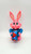 BOTOY Plastic Battery Operated Bunny Drumming, pink bunny toy with large ears holding a colorful drum.