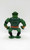 Masters of the Universe 1984 Leech Action Figure, front view of a green reptilian humanoid toy with muscular build, wearing black boots, a brown belt, and black and orange wristbands.
