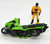 Kenner M.A.S.K. 1985 Condor Series 1 Vehicle, a green and black futuristic motorcycle toy with a yellow and red action figure standing next to it.