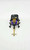 Transformers 1985 G1 Insecticons Bombshell Action Figure, front view of the toy with purple, yellow, and black colors on a white background.