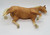 BREYER Vintage BREYER Palomino Arabian Stallion, detailed vintage model figurine of a Palomino Arabian horse lying on its side with a golden coat, light mane, expressive eyes, and realistic features.