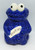 Sesame Street Cookie Monster Cookie Jar, ceramic cookie jar shaped like Cookie Monster holding a cookie with 'cookies' written on it.