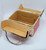 Delill Vintage Box/Train Purse -Red, open red vintage train-themed handbag with beige interior pockets and metal handle.