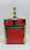 Delill Vintage Box/Train Purse -Red, red and gold vintage-style train-shaped purse with a metallic handle and detailed accents.