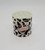 Hershey's Cow Moo-er Novelty Toy, cow-themed toy with a cow face and black and white cow print design.