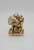 Harmony Kingdom Package Tour Camel Figurine, detailed ceramic camel carrying luggage and a person holding a bag, with intricate accessories and a decorative base.