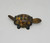 Unknown Tin Litho Turtle With Moving Head And Tail, metal toy turtle with rotating head and tail, featuring detailed shell and striped limbs, on a plain white background.