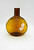 Clevenger Brothers Authentic Hand Made Glass Flask, amber-colored glass flask with a round body and narrow neck, featuring a label indicating its handmade origin from South Jersey.