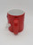 M&M's Red M&M With 3-D Hands Extended Coffee Mug, a red ceramic mug designed to look like the Red M&M character with three-dimensional white hands extending from the sides.
