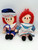 Applause Raggedy Ann and Raggedy Andy Dolls, plush vintage dolls in colorful outfits with red yarn hair and embroidered facial features.