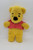 Disney Vintage Disney Winnie The Pooh Stuffed Animal by Sears, yellow plush Winnie the Pooh toy wearing a pink shirt with embroidered details.