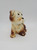 Unknown Vintage Ceramic Dog With Sad Eyes Planter, ceramic dog figurine with a planter form and a sad expression, featuring detailed painted accents and a small size suitable for plant display.