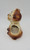 Unknown Vintage Ceramic Dog With Sad Eyes Planter, a ceramic planter shaped like a dog with a hollow body for planting, featuring a sad expression and a brown and cream color scheme.