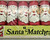 1974 Dan-Dee 6 pack of Santa Matches that are tubes with Santa on them.  The Santa face features the big guy with a jolly smile. Up close view of tears in plastic on front.