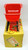 Minter Brothers Vintage Minter Brothers Plastic Candy Filled Santa's Sleigh, a vintage holiday collectible red plastic miniature Santa's sleigh with black metal runners, placed on a colorful festive box with holiday graphics.