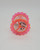 Vintage pink bird cage shaped plastic "spinner" Twinkler Christmas ornament. Bottom view