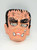 Bland Charnas Co., Inc Bland Charnas Halloween Costume Monster Size Small Mask and Box, featuring a scary monster face with exaggerated features and an open mouth, for Halloween costume.