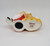 Applause Annie and Sandy Ceramic Bank, ceramic money box featuring Annie and Sandy characters lying down, painted in detailed colors.