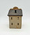 Windy Meadows Pottery Surgery And Apothecary Clay House, a handcrafted miniature clay house with a textured beige body, small square windows, and a wooden shingle roof.