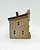 Windy Meadows Pottery Surgery And Apothecary Clay House, a handcrafted ceramic model of a house with small window cutouts and a textured roof, showcasing rustic and artistic design.
