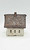 Windy Meadows Pottery Post Office Clay House, decorative ceramic house with textured brick roof and small windows.