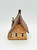 Windy Meadows Pottery Library Clay House, rustic miniature clay house with a textured roof and small windows.