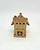 Windy Meadows Pottery Town Home Ornament, detailed miniature town house decorative ornament in beige with roof shingles and small windows.