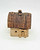 Windy Meadows Pottery Country Home Ornament, rustic miniature ceramic house with textured wooden roof and small windows.