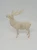 Unknown Vintage Christmas Plastic 5-inch Reindeer Toy Figure, a white plastic reindeer with detailed antlers and red eyes standing on a plain white background.
